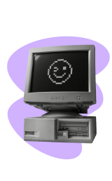 Computer with Smily Emoji in Screen