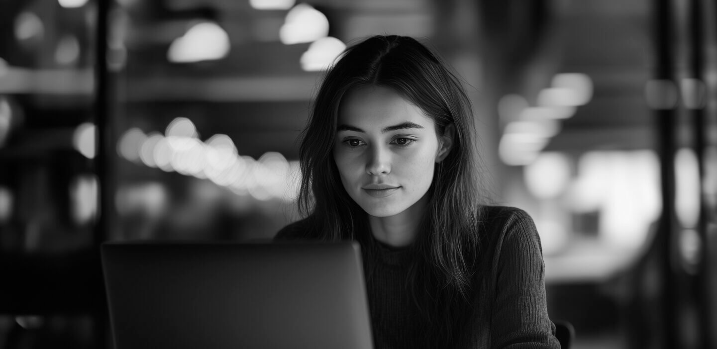 Woman looking at laptop screen